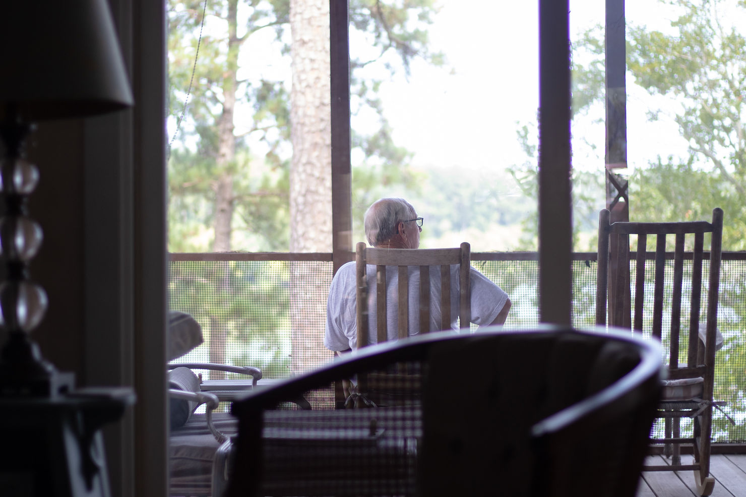 Picture of elderly person sitting on a balcony